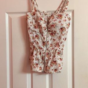 A cute top with Beautiful flowers on it.